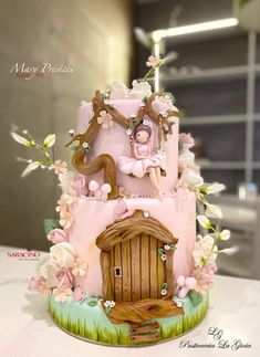 a cake that is shaped like a fairy house