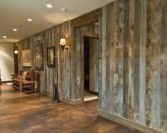 the inside of a house with wood paneling on the walls