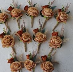 a bunch of fake flowers are arranged on a wall