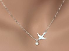 Dove Bird Necklace, Freshwater Pearl Necklace This necklace express for love and friendship All metal components onto High Quality Sterling Silver or 14k gold fill. This beautiful necklace consists of, -Sterling Silver Dove Pendent, -5mm Gem quality Freshwater Pearl and -Sterling Silver cable chain with end to end to Spring Claw. -Come up with beautiful ribbon gift box and -Care instruction pack . MORE BIRD https://www.etsy.com/shop/rainbowearring?ref=hdr_shop_menu&search_query=bird PET LOVE Silver Bird Shaped Jewelry For Gifts, Silver Bird-shaped Jewelry For Gift, Silver Bird-shaped Jewelry As Gift, Silver Jewelry With Bird Design, Elegant Bird Design Jewelry For Gift, Elegant Bird Design Jewelry For Anniversary, Elegant Bird Design Jewelry Gift, Adjustable Bird Design Jewelry For Gifts, Bird Pendant Necklace For Gift