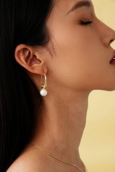 Edgy meets elegance with these pearl drops - obsessed! Elegant Dangle Hoop Earrings With Pearl Drop, Single Drop Pearl Earring, Pearl White Beaded Drop Earrings, Elegant Party Hoop Earrings With Pearl Drop, Elegant Pearl Earrings With Ear Wire, Chic Pearl Pendant Dangle Earrings, Elegant Teardrop Single Pearl Earring, Chic Pearl Drop Dangle Earrings, Pearl Drop Earrings With Pearl Charm