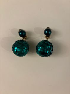 Disco Ball Earrings, Clip-On Earrings, Green Ball Earrings, Vintage Disco Ball Earrings, Jewelry, Earrings, Vintage Earrings, 1960's. These were my Mom's. I can still see her wearing them to a Christmas party in her green velvet with plaid long dress. She loved these earrings. They would make a statement for someone who has to wear clip-ons or even someone who has pierced ears. They are in good vintage condition. Retro Round Earrings For Party, Retro Party Earrings, Green Pierced Earrings For Party, Retro Clip-on Earrings For Party, Retro Green Earrings For Party, Retro Jewelry For Pierced Ears For Parties, Green Retro Party Earrings, Vintage Single Clip-on Earring For Parties, Retro Round Clip-on Earrings For Party