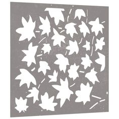 the white leaves are falling off of the black and white paper cutout, which has been placed in front of a gray background