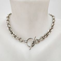 "A beautiful silver chain necklace with a toggle clasp. This chunky silver necklace has unique semi square shaped links.  Easy to match, this thick chain necklace will upgrade any outfit! Available in gold plating as well. Materials: Silver plated brass chain and elements - oxidized finish 24 k gold plated brass chain and elements - matte/shiny finish  Measurements: Chain width: 0.4\"/1.c\"m Clasp diameter: 0.8\"/2 c\"m Thickness: 0.12\"/3 m\"m For matching bracelet click: https://www.etsy.com/listing/1233583933/silver-chain-bracelet-chunky-silver?click_key=bdd8c30aef32e7a3583833ca8feba579eeb7938d%3A1233583933&click_sum=106f4013&ref=shop_home_active_14&pro=1&frs=1 For matching earrings click: https://www.etsy.com/listing/1258006535/silver-chain-earrings-silver-drop?click_key=790fc6b46cb5e0 Classic Chunky Chain Link Toggle Necklace, Classic Chunky Chain Toggle Necklace, Modern Chain Link Necklace With Toggle Clasp, Silver Chunky Link Chain Necklace, Silver Chain Link Necklace With Toggle Clasp, Modern Toggle Necklace With Chunky Chain Link, Silver Toggle Necklace With Chunky Oval Links, Silver Chain Necklace With Toggle Clasp, Silver Chunky Chain Necklace For Everyday