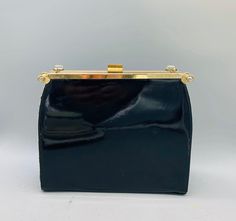 "Vintage Reversible Purse 3 in 1 Needlepoint/ Navy Blue and Black Patent Leather Top Handled Purse The purse measures 8\" tall and the handle adds an additional 5\" 2.5\" wide 9\" long clear lucite handle attached. The purse opens via the latch on top and has an inside pocket The needlepoint cover can detach from the sides revealing a matte navy blue purse, or you can flip the floral side over and attach the patent leather black cover making this purse the only one you'll ever need! SHIPPING est Evening Pouch Box Bag, Compact Leather Bags For Formal Occasions, Rectangular Leather Coin Purse For Evening, Rectangular Leather Evening Coin Purse, Chic Compact Coin Purse For Formal Occasions, Elegant Coin Purse With Snap Closure For Everyday, Formal Box Bag With Handles In Pouch Shape, Formal Box Bag With Handles, Compact Black Bag For Formal Occasions