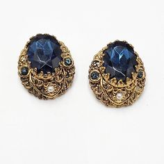 Vintage W. Germany Deep Blue Glass Faux Pearl Gold Tone Filigree Clip Earrings. Lovely Layered Earrings! In Great Condition. Has Minor Signs Of Wear. Please See Pictures For More Details. Elegant Blue Clip-on Earrings For Formal Occasions, Elegant Formal Blue Clip-on Earrings, Elegant Blue Formal Clip-on Earrings, Blue Oval Earrings For Evening, Vintage Blue Earrings For Formal Occasion, Vintage Blue Earrings For Evening, Vintage Blue Clip-on Earrings For Evening, Victorian Blue Earrings For Formal Occasions, Ornate Blue Earrings For Formal Events