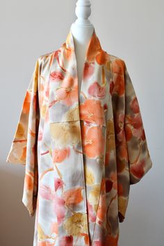 🌸Vintage Homongi Yellow Orange Long Kimono Jacket in medium weight silk crepe with a beautiful Japanese flower floral  pattern. Traditional lining. You can wear this kimono for formal events like wedding parties, annual parties, parents' days or simply for visiting friends. Both married and unmarried women can wear these kind of semi-formal kimono types. 🌸MEASUREMENTS taken lying flat : Width : Back of the neck to end of the sleeve 62cm (24.5inch) Length : 150cm (59inch) 🌸MATERIAL: Japanese Silk 🌸CARE : dry clean recommended 🌸CONDITION: vintage and good condition. Please note there are some aged stains on the lining inside near the neckline. All kimono are originally made in Japan.  🌸COLOR: All my pictures are taken with natural light, please refer to the photos and video for best id Spring Silk Outerwear With Kimono Sleeves, Silk Outerwear With Kimono Sleeves For Spring, Silk Long Sleeve Floral Print Kimono, Kimono Types, Formal Kimono, Long Kimono Jacket, Unmarried Women, Fashion Japanese, Mode Kimono