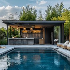 an outdoor bar next to a swimming pool