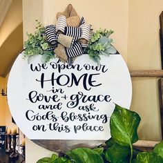 a sign that says, we open our home in love and grace god's blessing on this place