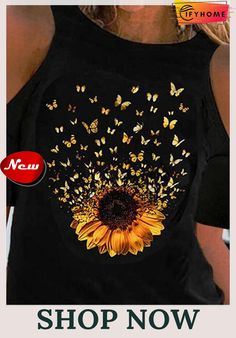 a woman wearing a black tank top with butterflies on it and the words shop now