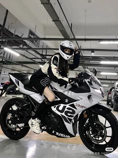 a person on a motorcycle in a garage