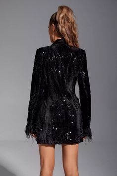 How to define the charm of our Wynter Black Feather Blazer Satin Dress? That must be sexy, elegant and capable. Sequin satin fabric, deep V -neckline, ostrich feathers at the long sleeve cuffs, and the skirt lowered to the root of the thighs. All this constitutes this mini dress. You only need to match a pair of high heels to complete an unique look!  Dress Length: Approx 80cm Materials: Satin Gentle Dry Clean Only  The model is 5 ft 7 and wears size S  Color may vary due to lighting on images. Blazer Satin Dress, Silver Sequin Top, Glitter Wedding Dress, Bandage Midi Dress, Floral Shirt Dress, Feather Dress, Puff Sleeve Dresses, Ostrich Feathers, Black Feathers