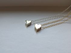 dainty heart bead necklaces in sterling silver or golden bronze finish of your choice. charm size 7.5x7.5mm sterling silver heart with sterling silver chain golden bronze heart with 14k gf chain. adjustable 16-18'' 18th Birthday Gifts For Girls, Friends Birthday Gift, Best Friends Birthday, Small Heart Necklace, Soul Sisters Gifts, Best Friend Christmas Gifts, 13th Birthday Gifts, January Birthday Gifts, 2 Best Friends