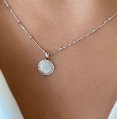 From our P.S. Collection, the P.S. Small Round Necklace is delicate frame of milgrain detail, with space for three custom engraved letters, like a cherished set of initials. Engraving is complimentary in your choice of font. Available with our suggested 18K Oval Link Chain or as a solo charm to curate into your everyday neck story. 18K Yellow Gold Charm 18K Yellow Gold Oval Link Chain Pendant Length: 10mm Chain length: 16" Signature Rings, Rainbow Sapphires, Sapphire Band, Moment In Time, Round Necklace, Rose Gold Chain, White Gold Necklaces, Bridal Bands, Add Text