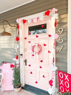 a front door decorated for valentine's day