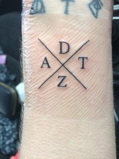 a person's arm with the word adz on it and an arrow in the middle