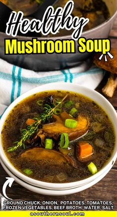 a bowl of mushroom soup on a wooden table