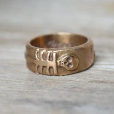 Unique Carved Engraved Promise Ring, Unique Carved Engraved Ring For Promise, Symbolic Engraved Skull Ring Gift, Symbolic Engraved Skull Ring For Gift, Spiritual Engraved Carved Ring For Anniversary, Symbolic Carved Engraved Ring For Anniversary, Antique Engraved Skull Ring As Gift, Antique Engraved Skull Ring For Gift, Unique Engraved Skull Ring For Anniversary