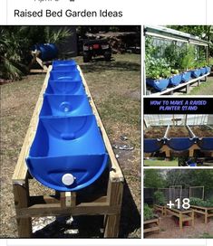 a long row of blue barrels sitting on top of a wooden pallet in the grass