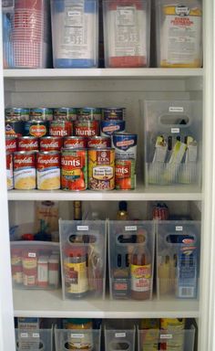 an organized pantry with plastic bins and containers