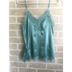 This Satin Cami Is A Great Addition To A Wardrobe To Add Great Texture And Color. It Is Very Silky And Flattering With Lovely Lace Detailing. Pair This With Ripped Jeans And A Blazer For A Smart Juxtaposed Look. Approximately 26” Length And 17” Bust, With Adjustable Straps. Brand New With Tags! Blue Sleeveless Camisole With Built-in Bra, Blue Lace Trim Camisole For Summer, Elegant Blue Tank Camisole, Light Blue Spring Camisole With Spaghetti Straps, Light Blue Camisole For Spring, Light Blue Fitted Sleeveless Camisole, Fitted Light Blue Sleeveless Camisole, Fitted Light Blue Camisole, Blue Cami Camisole For Daywear