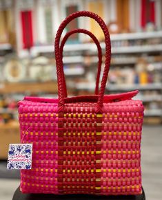 Tough, cute, and eco-friendly, these bags are great for everyday use! Handwoven from recycled plastic, every pattern is unique. Some are even accompanied by a vibrant, handmade pom-pom/heart ornament! Measurements are formatted: L x W x H in inches. Handmade in Oaxaca, México. Eco-friendly Red Shopping Bag, Casual Fair Trade Shopping Bags, Red Reusable Casual Bag, Red Casual Reusable Bag, Pink Rectangular Recyclable Bag, Rectangular Pink Recyclable Bag, Eco-friendly Handmade Red Bag, Eco-friendly Red Handmade Bags, Multicolor Fair Trade Shopping Bags