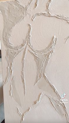 an abstract painting with white paint on it