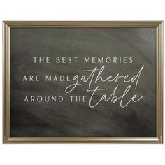 the best memories are made ahead around the table on a blackboard with gold frame