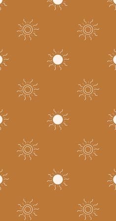 an orange and white pattern with sun's on it