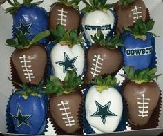 chocolate covered strawberries in a box with the word cowboys painted on them and decorated like footballs