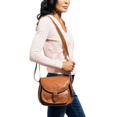 The brown leather crossbody purse brings timeless style to any wardrobe. Beautifully designed and handcrafted in rich, burnished leather, this signature crossbody purse comes equipped with a divided interior and an extra exterior pocket, so you can stay organized all day long. Pair this classic crossbody purse with closed toe sandals and an open mind or gladiator sandals for women and wild adventures. Whether it's on your daily commute or a weekend away from it all, this handcrafted leather bag Timeless Brown Satchel With Adjustable Strap, Classic Crossbody Saddle Bag For On-the-go, Classic Soft Leather Saddle Bag For On-the-go, Leather Saddle Flap Bag For Everyday Use, Timeless Shoulder Bag For Travel In Fall, Timeless Saddle Shoulder Bag For Everyday, Timeless Shoulder Saddle Bag For Everyday Use, Timeless Brown Saddle Satchel Bag, Timeless Brown Flap Bag For Everyday Use