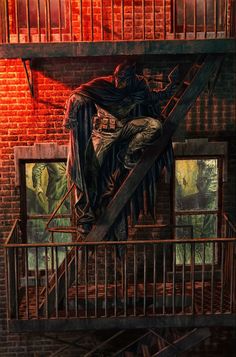 a painting of a man sitting on top of a cross in front of a brick wall