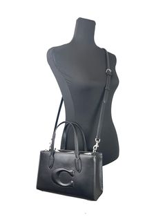 Style: Coach (CR097) Nina Small Tote Crossbody Bag (Black) Material: Leather Features: Adjustable Crossbody Strap, Zip Closure, Fabric Lined Measures: 10" L x 6.5" H x 4" D Coach Medium Leather Shoulder Bag, Luxury Medium Shoulder Bag For Evening, Medium Evening Bags, Chic Evening Medium Bag, Chic Medium Evening Bags, Elegant Medium Evening Bag, Medium Leather Evening Shoulder Bag, Medium Leather Shoulder Bag For Evening, Medium Satchel With Detachable Handle