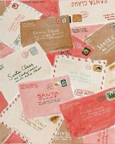 many different colored envelopes with stamps on them and some writing on the back side