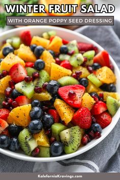 a white bowl filled with fruit salad on top of a table