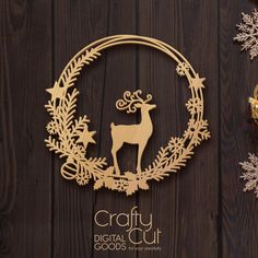 a wooden cutout of a deer surrounded by christmas decorations on a dark wood background