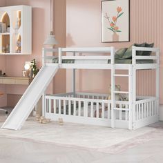 a white bunk bed with a slide next to it in a pink walled room,