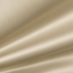 a close up view of a white satin fabric