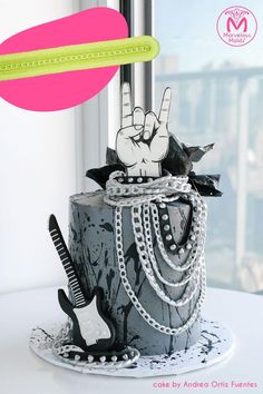 a cake decorated to look like a rock and roll