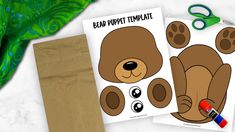 two brown paper bags with bear puppet templates on them