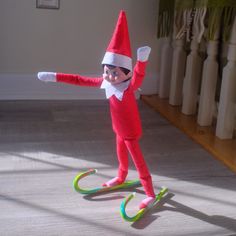 In this post I'll show you a ton of cool and silly off on the shelf candy cane ideas that you won't need to spend hours on - they're easy! Elf On Shelf Cheerleader, Girl Elf Ideas, Bluey Themed Elf On The Shelf, Elf Ideas With Candy Canes, Elf On The Shelf Cotton Candy, Elf On The Shelf Skiing, Elf Easy Ideas, Elf On The Shelf Candy Cane Ideas, Elf Skiing