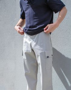 LIMITED High quality, hand made, designer men's pants, made with this high quality breathable fabric in a light grey is structured and comfortable!  Fits best W32 Inseam: 34" Two side pockets and a fly zipper! Modeled by: Carter Ragsdale Streetwear Cargo Pants With Welt Pockets, Streetwear Straight Cargo Pants With Welt Pockets, Gray Straight Cotton Cargo Pants, Gray Cotton Straight Cargo Pants, Gray Relaxed Fit Straight Leg Cargo Pants, Grey Cargo Jeans With Side Pockets For Streetwear, Gray Utility Cargo Pants, Urban Beige Pants With Pockets, Gray Utility Cargo Pants With Multiple Pockets