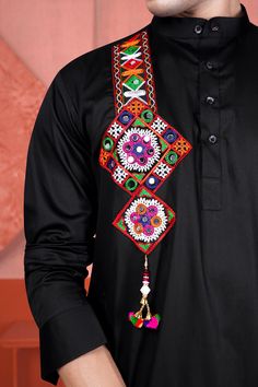 Radiate elegance during Navratri with our Jade Black Multicolour Kutch Work Patches and Mirror Work Designer Kurta Set. Crafted from super-soft premium cotton fabric with a subtle sheen, this ensemble showcases exquisite Kutch work patches and mirror work on both sides. It's the ideal choice for those seeking the perfect Navratri kurta that combines tradition and style in one stunning outfit. Kurta Fabric: 100 % Premium Cotton. Limited quantity, Seasonal collection. We change our fashion very fr Mens Navratri Kurta Designs, Navratri Kurta For Boys, Navratri Outfits For Men, Navratri Kurta For Men, Navratri Patches, Bharat Work, Garba Choli, Kurta Designs Men's, Boys Kurta Design