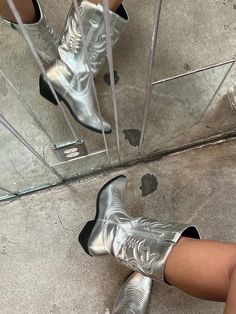 The ultimate space cowgirl boot! These western boots are a metallic silver color & feature a comfortable low black heel. shaft reached mid calf  brand: SODA Silver Heeled Boots For Fall, Silver Fitted Snip Toe Boots, Trendy Silver Pointed Toe Heeled Boots, Silver Ankle Boot Heeled Boots For Fall, Silver Ankle Heeled Boots For Fall, Silver Fitted Heeled Boots For Fall, Trendy Silver Heeled Boots For Fall, Silver Fitted Ankle Boots, Silver Western Boots With Snip Toe