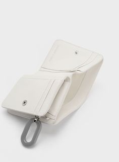 Cream Oval Keychain Zip Wallet | CHARLES & KEITH White Rfid Blocking Wallets, White Rfid Blocking Wallets For Everyday, Modern White Wallet With Rfid Blocking, White Bifold Wallet With Rfid Blocking, Modern White Bifold Wallet, White Wallets With Interior Card Slots For Everyday, Modern White Rectangular Wallet, White Bifold Wallet For Everyday Use, Everyday White Bifold Wallet