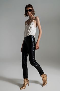 Introducing our Black Faux Leather Effect Skinny Pants, a must-have wardrobe staple that combines edgy style with a flattering silhouette. These full-length skinny pants are designed to fit like a second skin, hugging your curves in all the right places. The sleek and skinny fit adds a touch of sophistication to any outfit, making them perfect for parties and special occasions. Crafted from a combination of 55% Polyurethane and 45% Polyester, these pants boast a faux leather effect that exudes a Cream Shirt, Color Crema, Stylish Party, Lace Trims, Edgy Look, Cream Lace, Cami Top, Look Chic, Fast Fashion