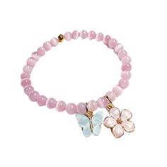 Fashionable Chic 7.5-inch stretchy bracelet is sure to provide you with a fresh and elegant feel.  Gorgeous 6mm pink translucent cats-eye beads with 10mm dangling butterfly and flower charms. Great accent piece for everyday or for your special occasion. Perfect Valentine Day or Mother's Day gift or holiday gift giving. Can also be worn as an ankle bracelet. Pink Flower-shaped Beaded Bracelets, Elegant Pink Flower Charm Bracelet, Pink Adjustable Flower-shaped Beaded Bracelets, Elegant Pink Flower-shaped Bracelet, Pink Flower-shaped Beaded Charm Bracelet, Pink Beaded Bracelet, Pink Beaded Bracelets, Butterfly And Flower, Pink Beaded