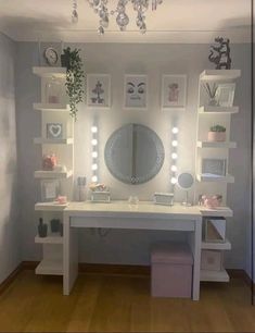 a white desk topped with lots of drawers under a mirror