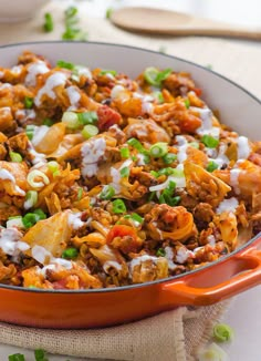 a bowl filled with food sitting on top of a table