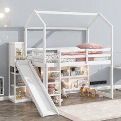 a white bunk bed with a slide in the middle